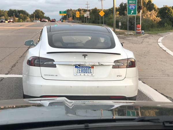 Tesla with Zero Oil license plate