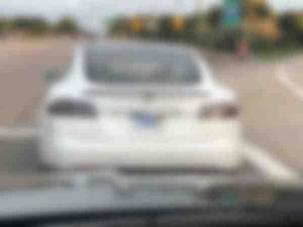 Tesla with Zero Oil license plate